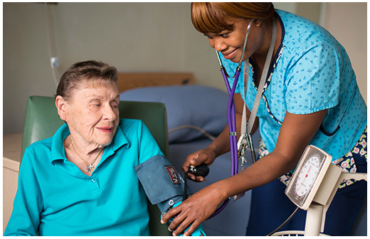 Kind nurse caring for a resident